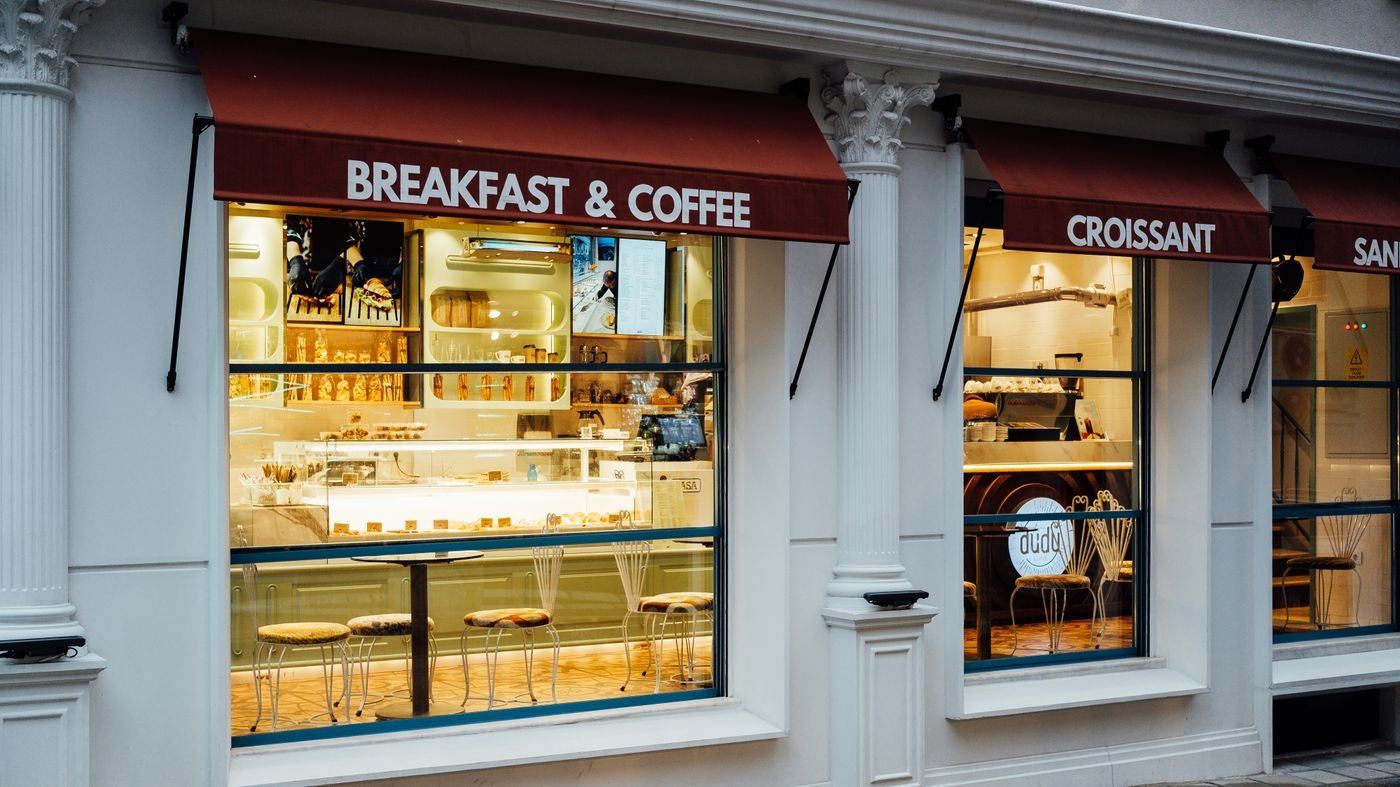 Charming CafÃ© with Breakfast and Coffee Setup — illustrative Pexels photograph