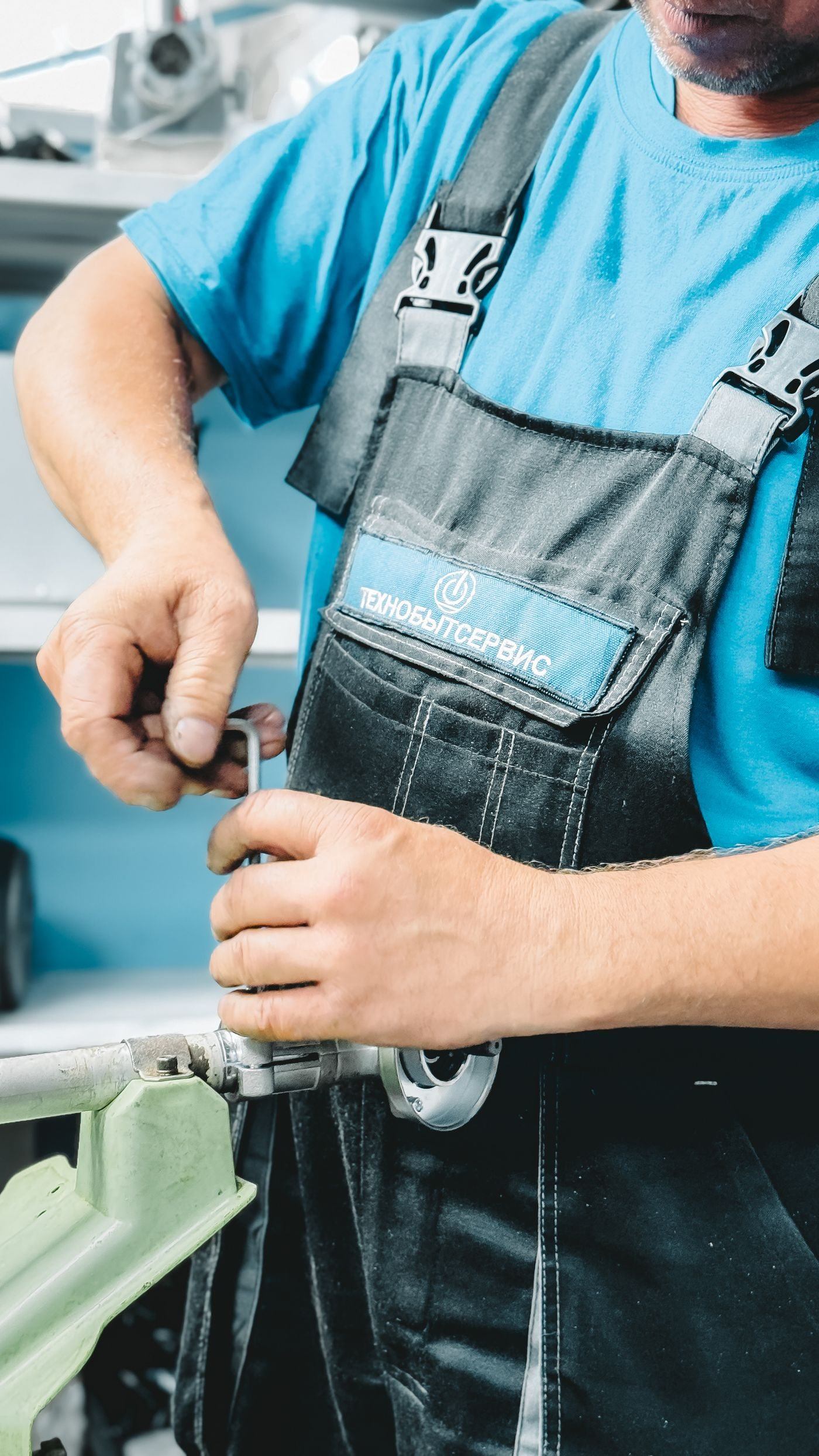 Plumber Repairing Pipe with Wrench Indoors — illustrative Pexels photograph