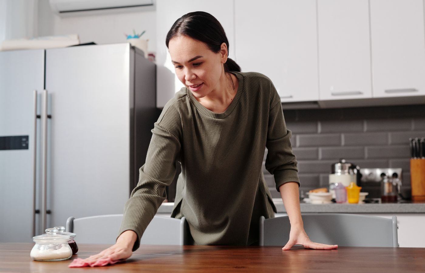 Woman Wiping the Table — illustrative Pexels photograph