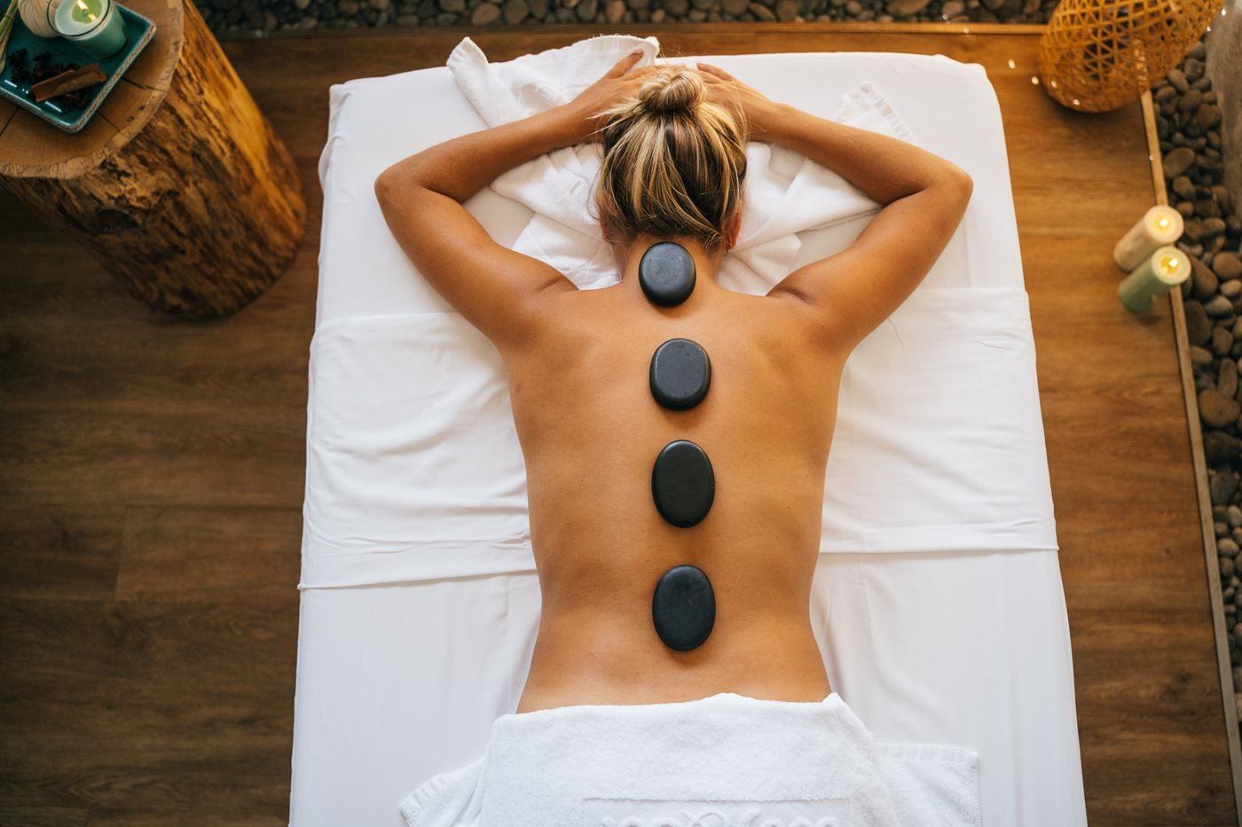 Stones on a Woman's Bare Back — illustrative Pexels photograph