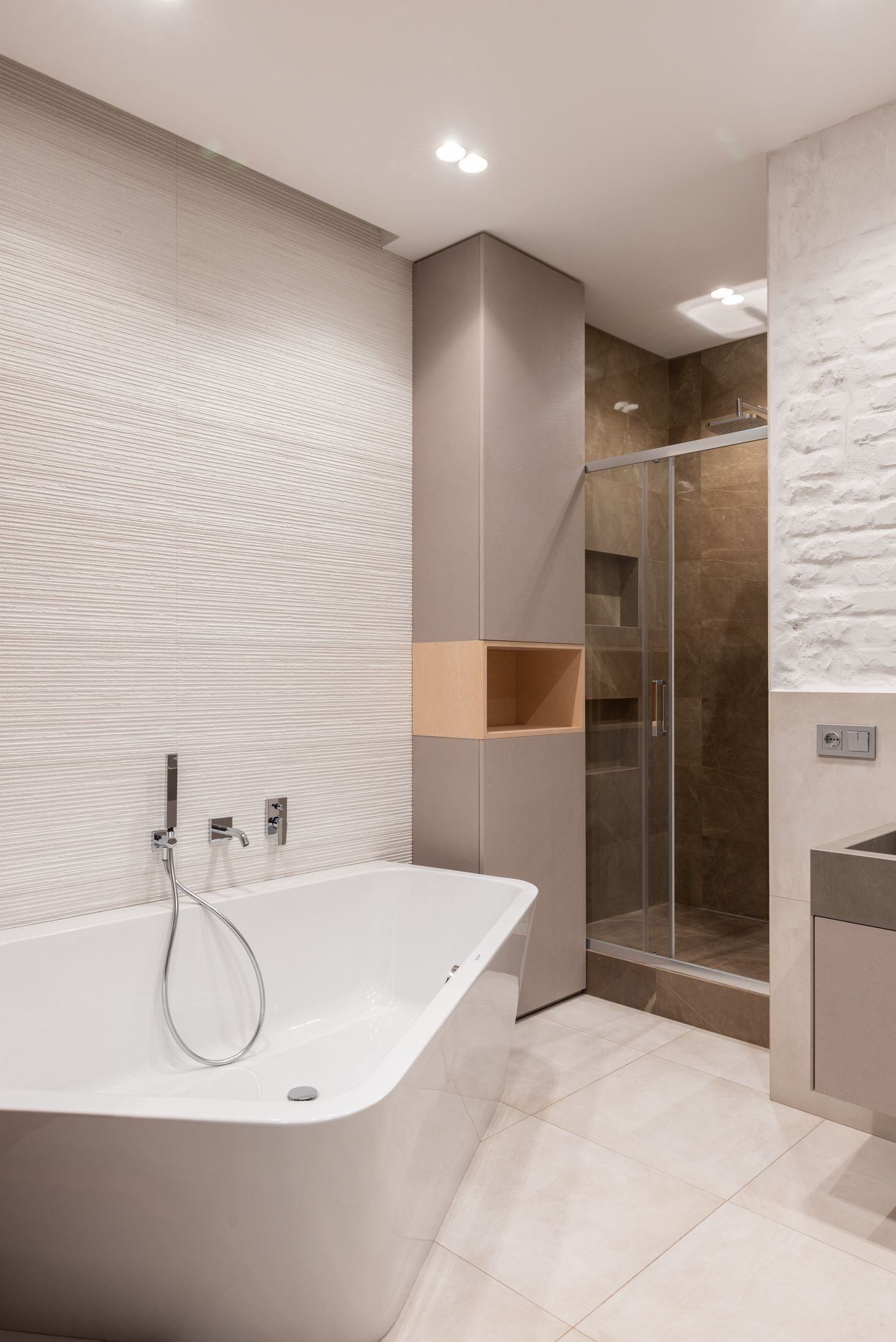 Bathroom interior with bathtub next to shower — illustrative Pexels photograph