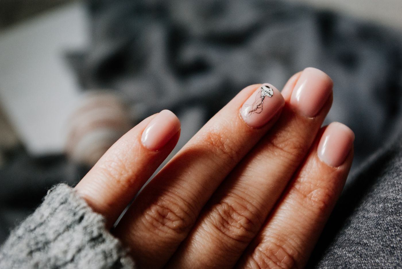 Crop faceless woman showing manicure with nail art — illustrative Pexels photograph