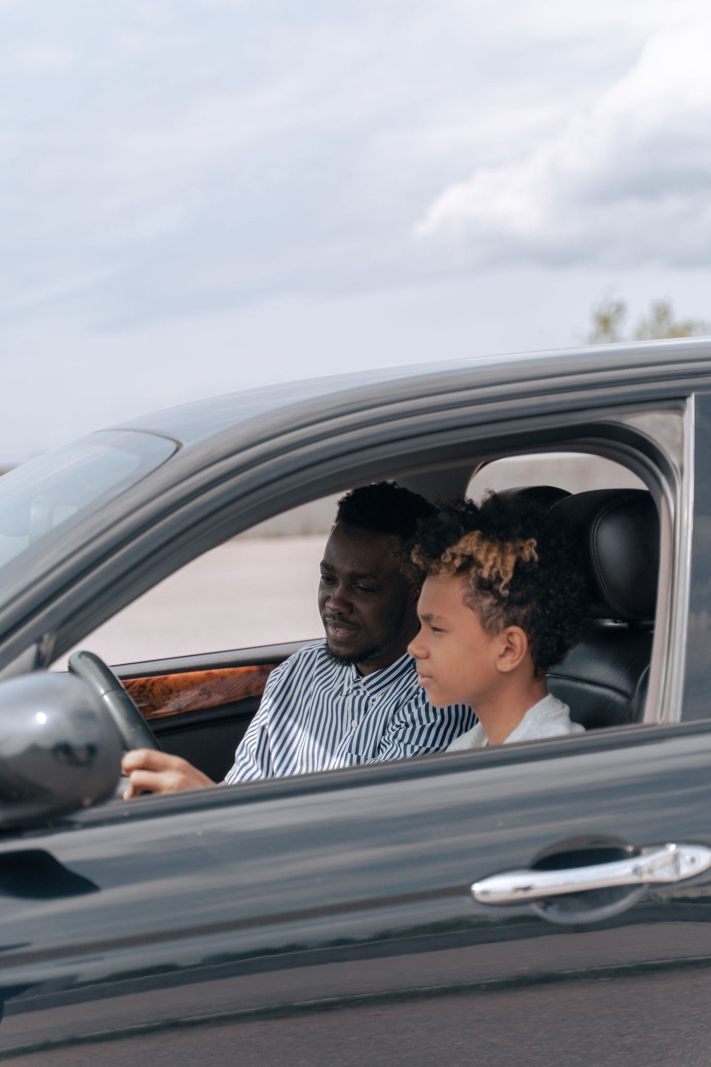 Man in White and Black Striped Dress Shirt Driving Car — illustrative Pexels photograph