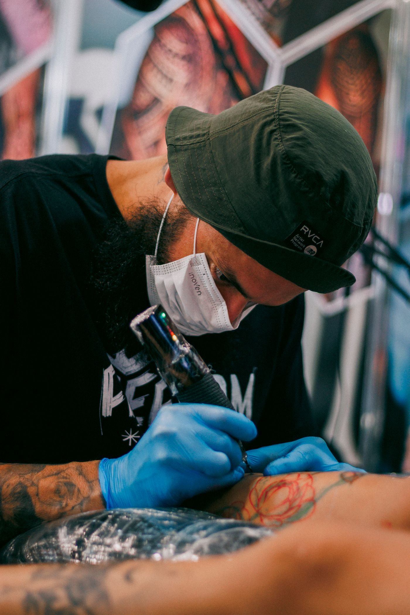 Close-up of a tattoo artist at work — illustrative Pexels photograph