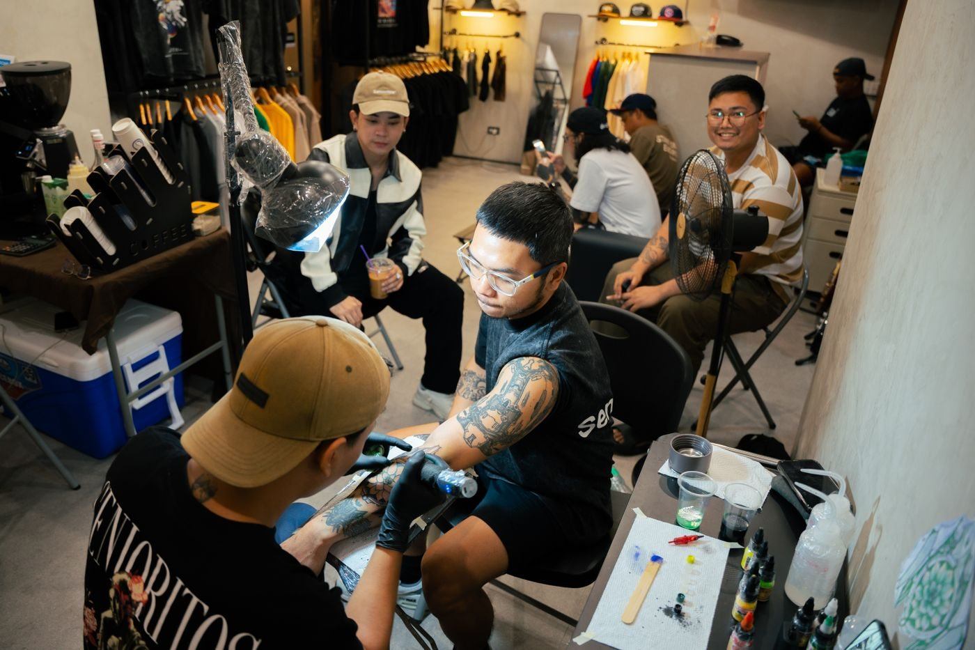 Artists working in a tattoo studio — illustrative Pexels photograph